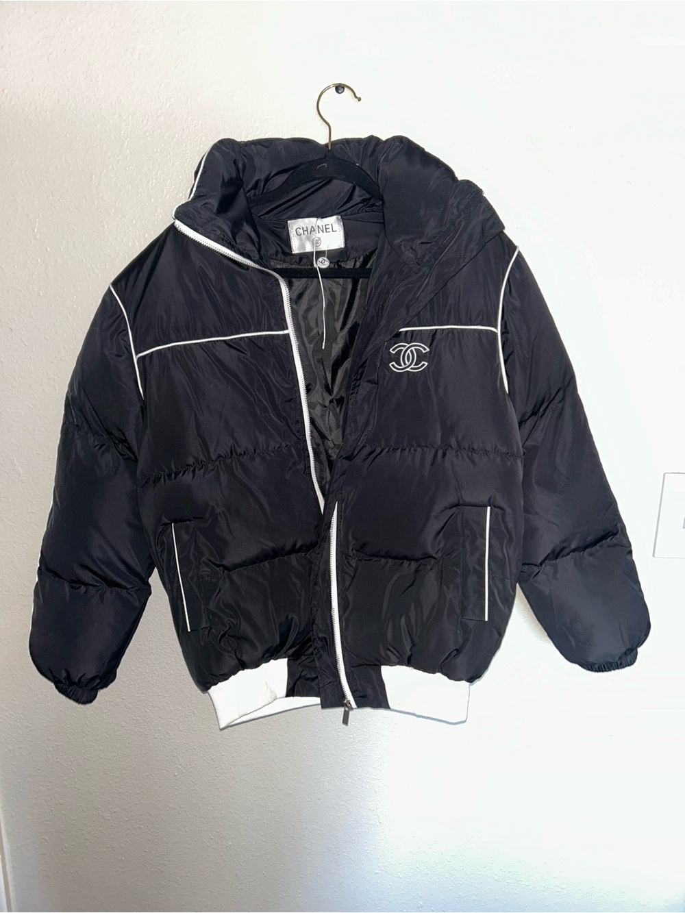 CHANEL Black Puffer Jacket with White Trim